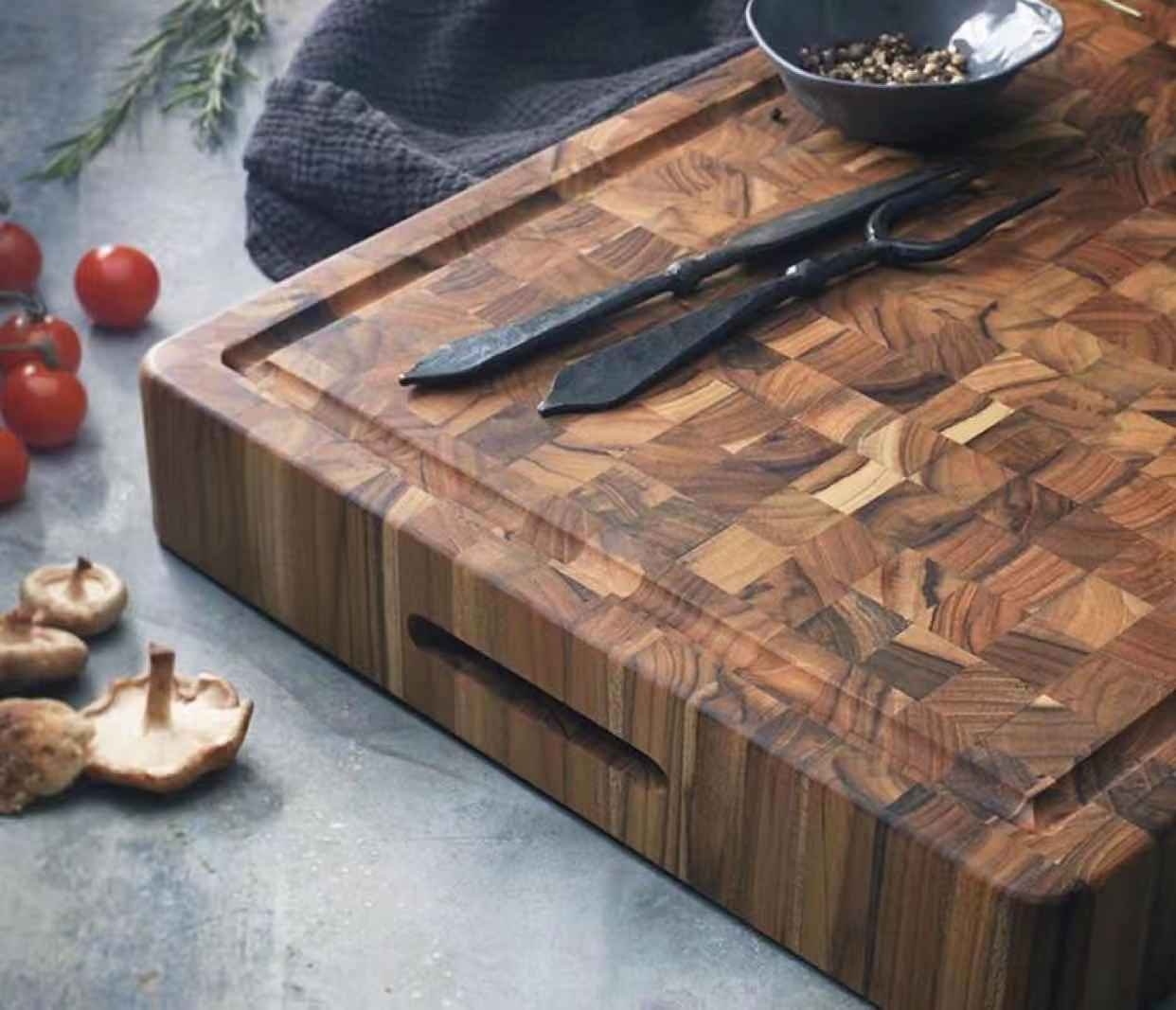 Teak end grain cutting board with inner handle